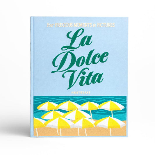 La Dolce Vita photo album cover, blue background with green script and yellow umbrellas