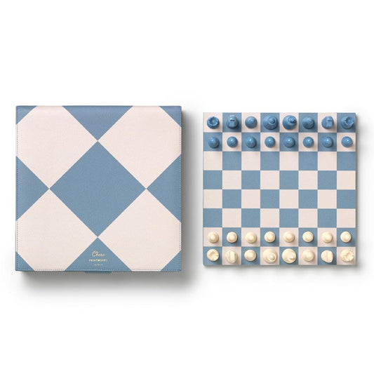 Chess set with blue-and-cream checkered board and matching blue and cream pieces