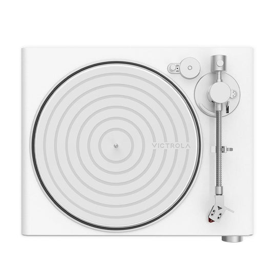 White and silver top-view turntable with platter, tonearm, and control dials