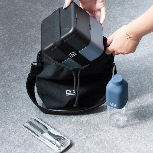 Insulated lunch bag with open lid and drawstring, showing interior; includes bottle and utensils.