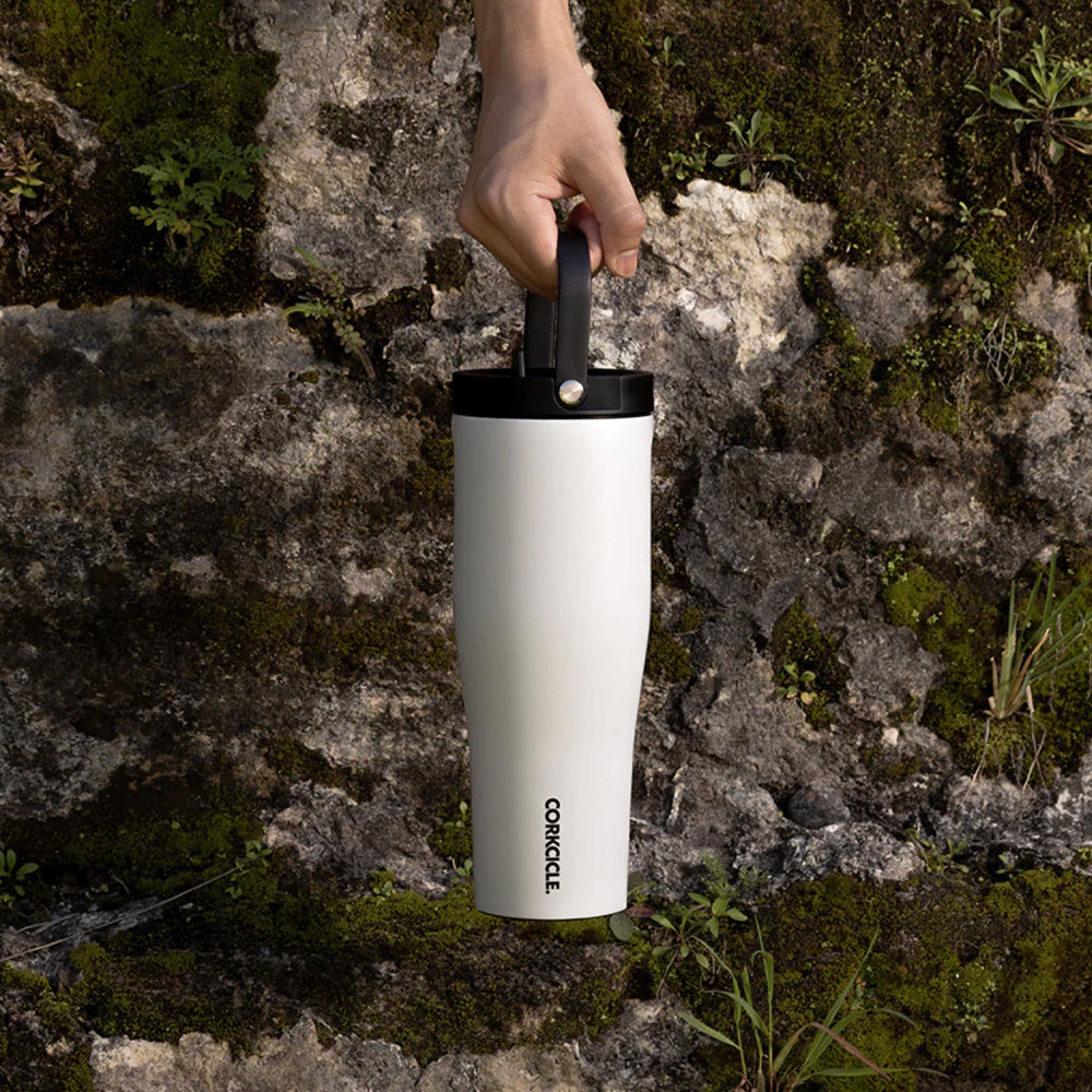 Corkcicle Go Cup XL insulated travel cup in gloss white with black lid, held in hand