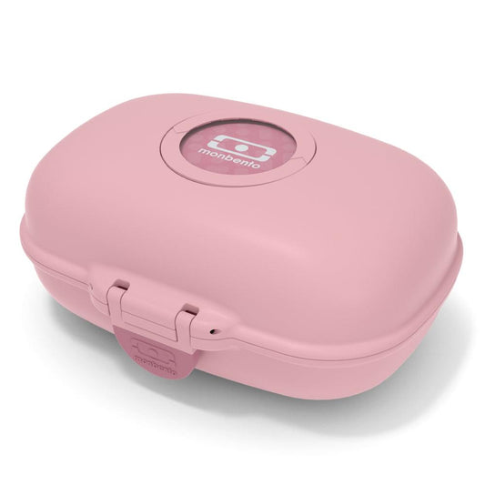 Monbento kids snack box in pink with circular seal and side latches, closed.