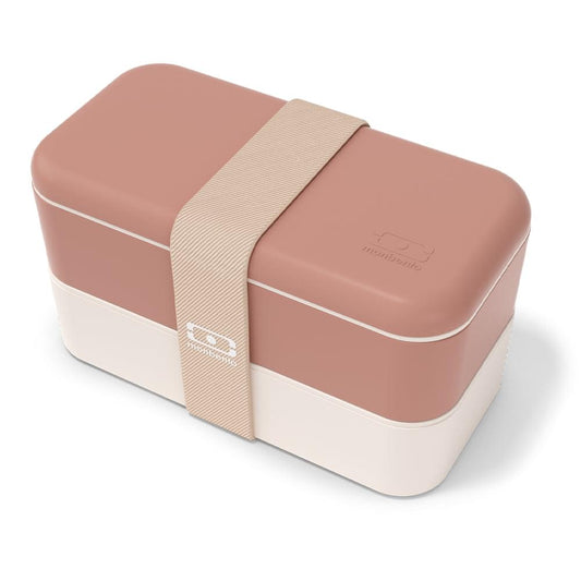 Rectangular bento box with rose lid, white base, and beige strap holding it closed