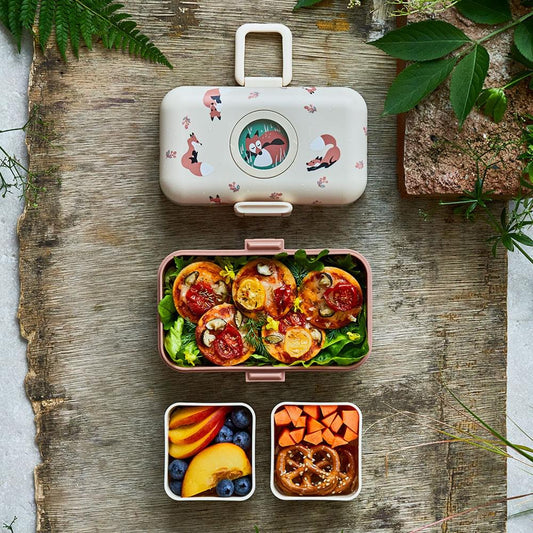 Kids bento box with fox lid open, main compartment with pasta, carrots, and greens