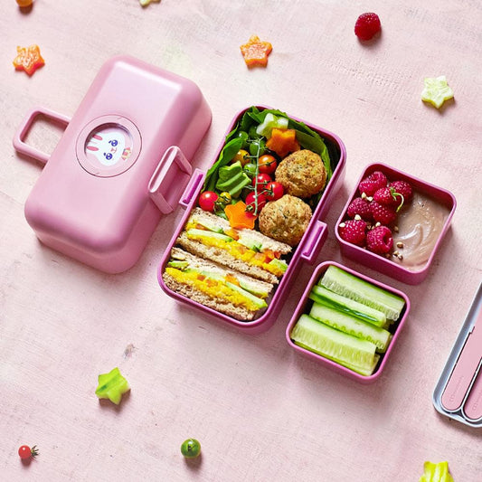 Monbento Tresor kids bento box in pink blush, open with 3 compartments and handle