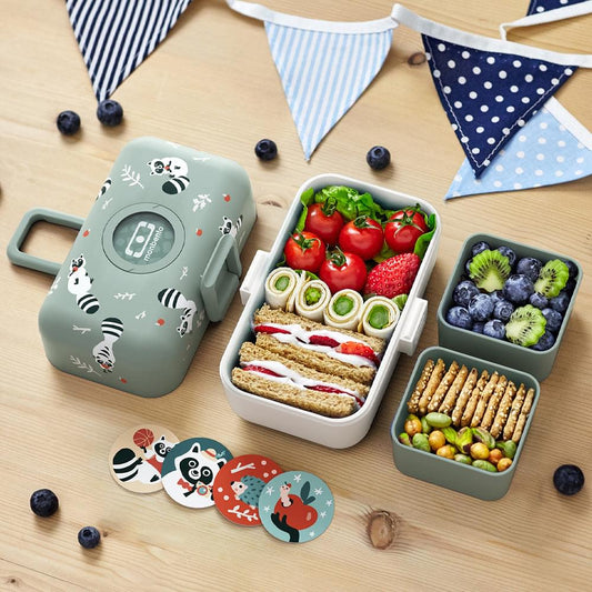 Kids bento box with mint lid, open sections filled with assorted food