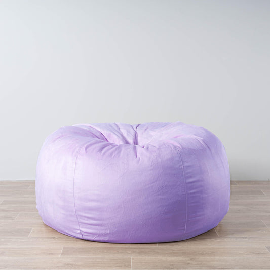 Lilac faux fur bean bag, rounded cylindrical shape with tufted top.