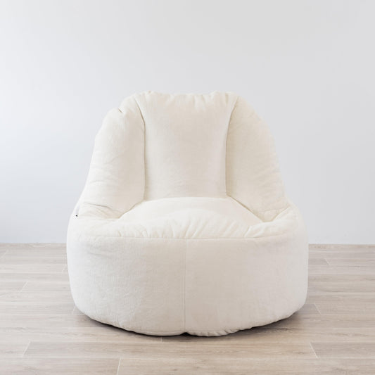 Cream plush bean bag chair cover with rounded back and vertical seam panels