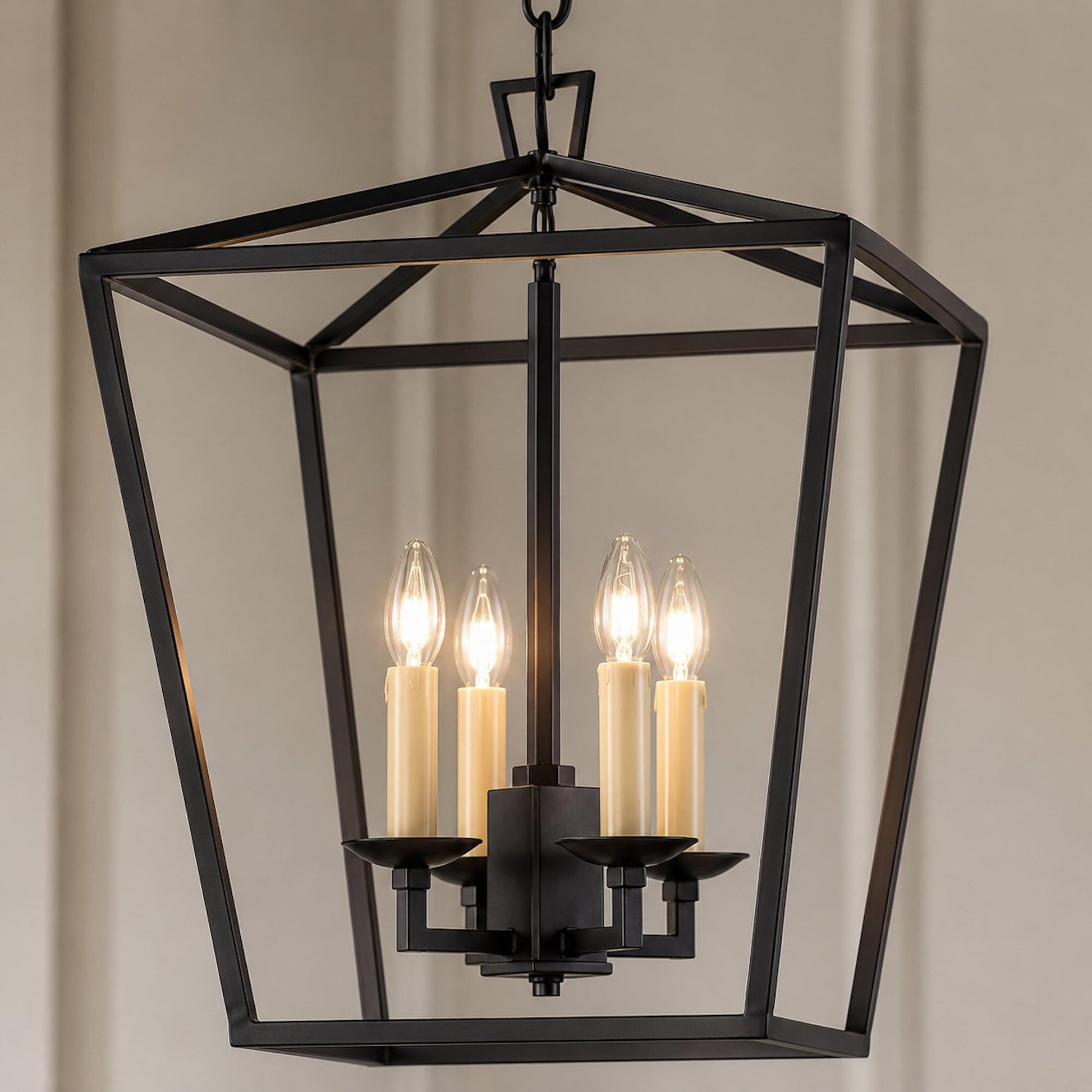 Geometric matt black pendant lantern with four illuminated candle-style bulbs