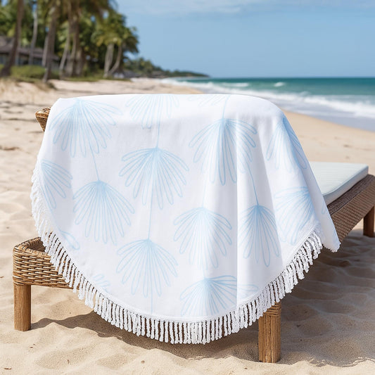 Round beach towel/blanket in white with light-blue dandelion pattern and fringe