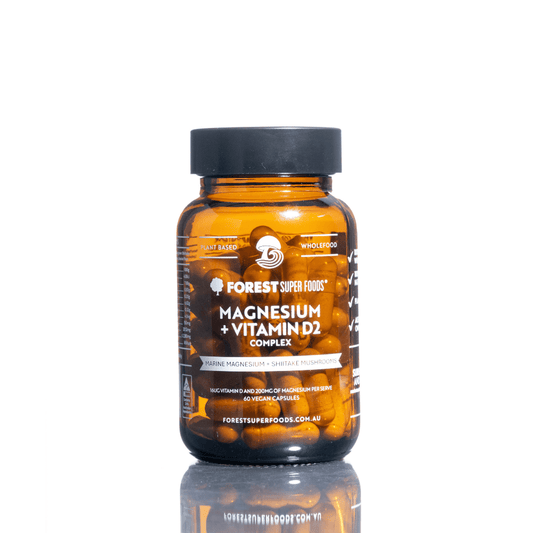 Amber magnesium supplement bottle with black cap, front label visible