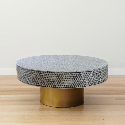 Round black inlay coffee table with mother-of-pearl mosaic top and gold base