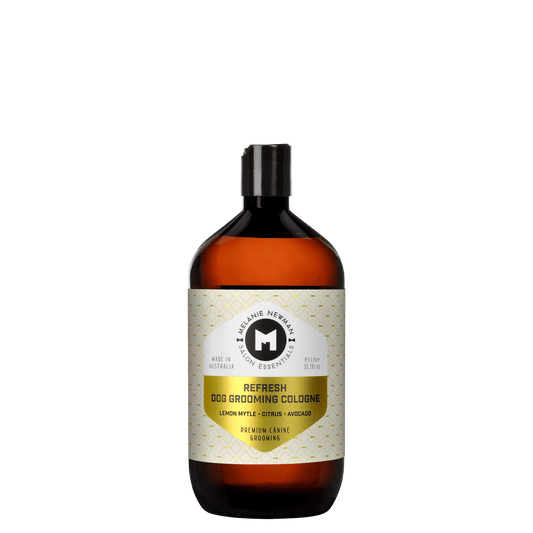 Dog grooming cologne bottle with black cap, amber liquid