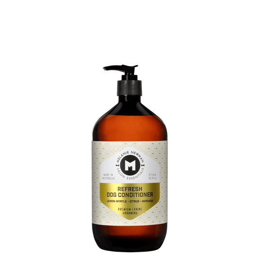 Melanie Newman refresh dog conditioner bottle close-up, amber bottle and black pump