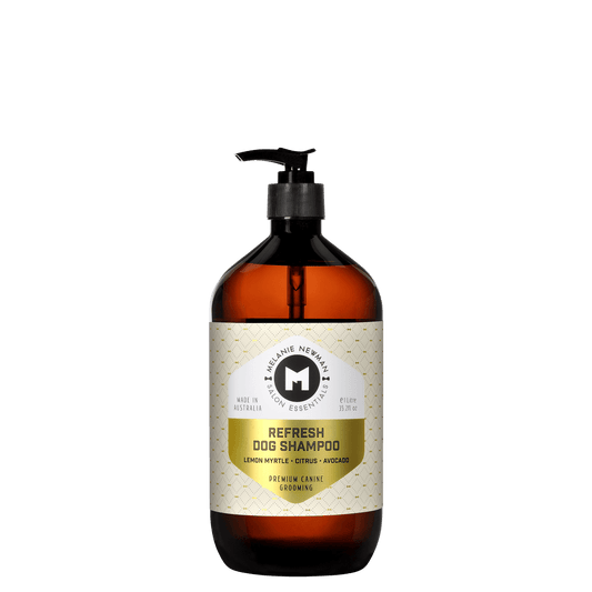 Refresh dog shampoo bottle, front view with black pump and amber bottle label