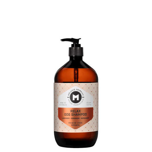 Relax dog shampoo bottle with black pump, amber liquid, front label