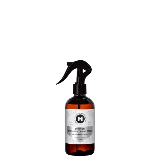 Melanie Newman coat conditioning spray bottle with black mist trigger and amber tank