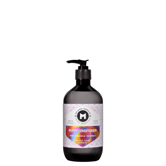 Melanie Newman Puppy Conditioner bottle with pump, dark bottle and purple patterned label