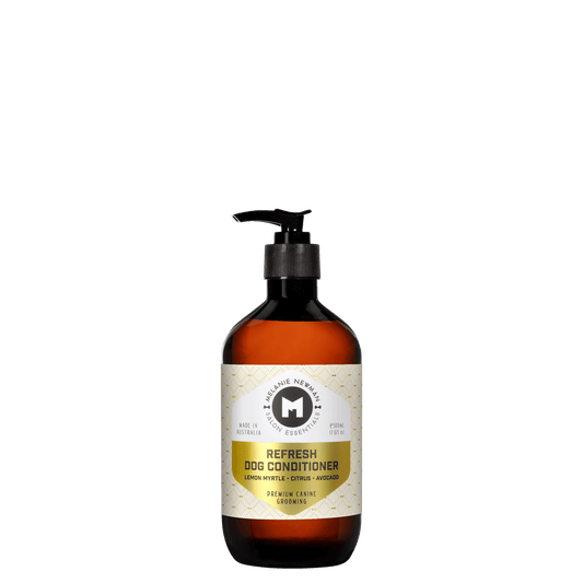 Melanie Newman refresh dog conditioner bottle with black pump, amber liquid and label