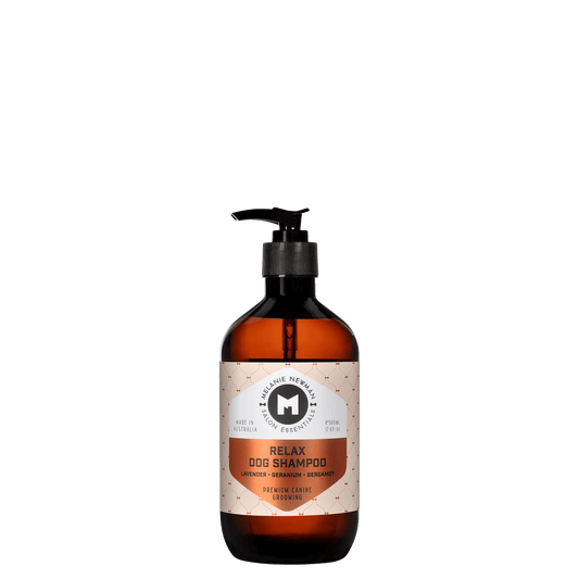 Relax dog shampoo bottle with black pump, amber liquid, lavender label
