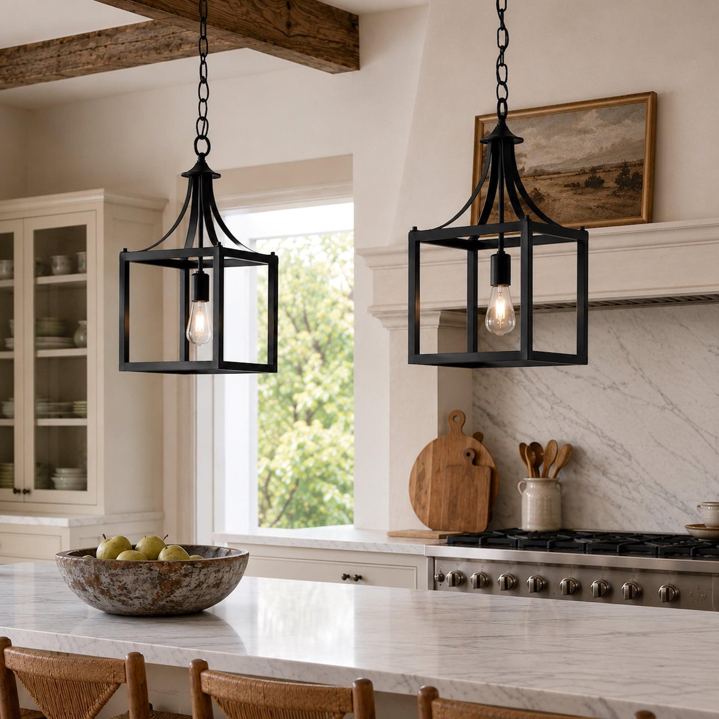Black lantern pendant lights with open metal frames above kitchen island