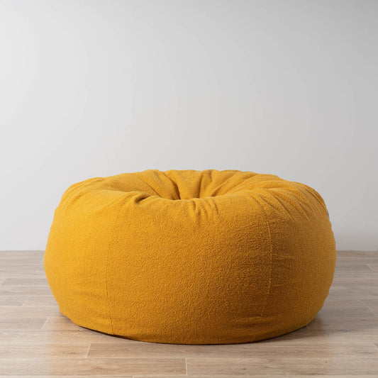 Mustard boucle fabric bean bag with rounded oval shape