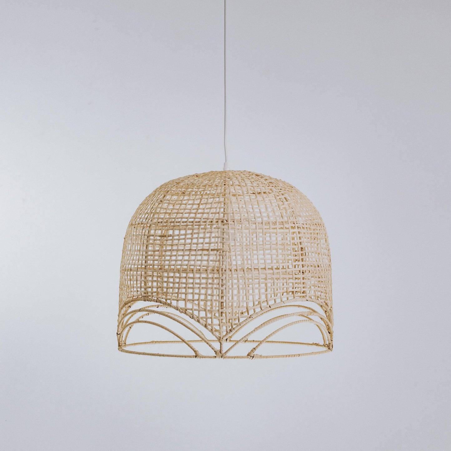 Natural rattan pendant light, small domed lattice shade with scalloped band detail