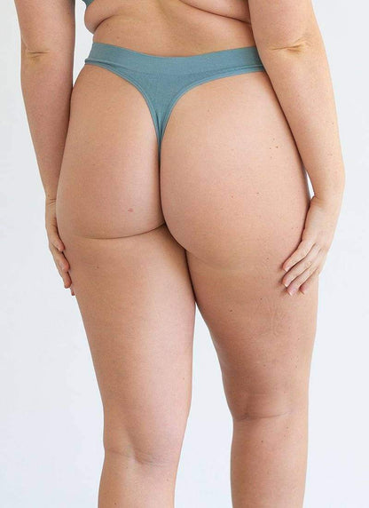 Blue cheeky G-string underwear, rear view with high-cut sides and elastic waistband
