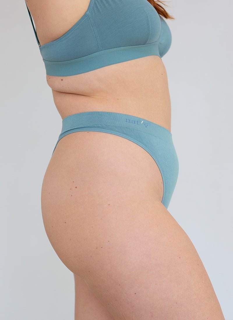 Blue cheeky G-string underwear, back view with narrow coverage and elastic band