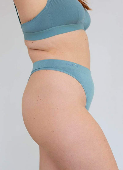Blue cheeky G-string underwear, back view with narrow coverage and elastic band
