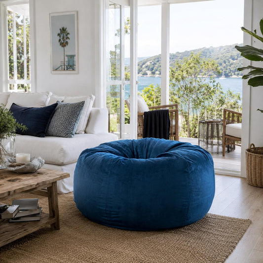 Ocean blue rounded bean bag in living room, plush fur-style upholstery