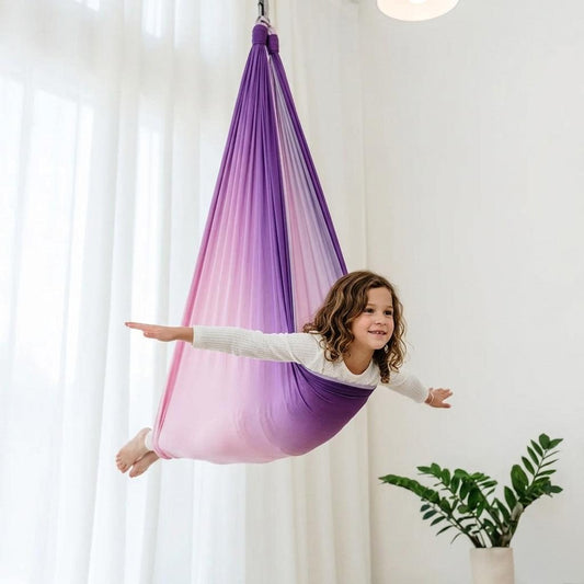 Pink-to-lilac ombre therapy swing cocoon with soft knit interior hammock