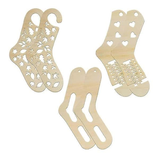 Wooden sock blockers set with floral cutouts and heart-shaped openings, natural wood.
