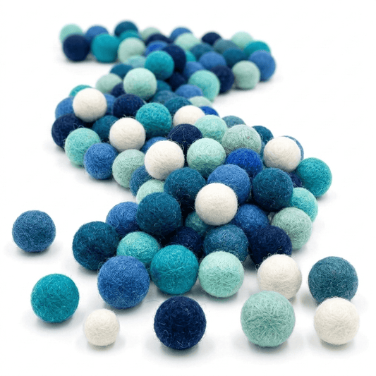 Handmade wool felt balls, teal and blue with white accents