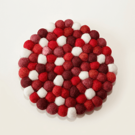 Handmade wool felt trivet, round berry-red with white felt balls pattern