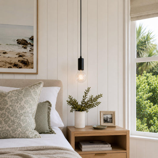 Matte black pendant light with clear glass bulb and hanging cord