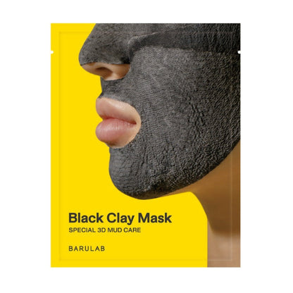 Black clay mask sheet, close-up of charcoal-gray molded mask over face
