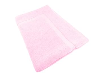 Baby pink cotton bath mat with soft loop pile, folded for storage