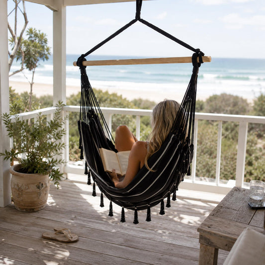 Black pinstripe hanging hammock chair with seat and matching cushion