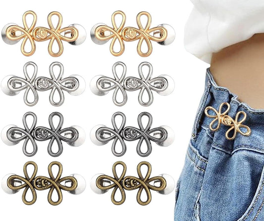 Waistband stretcher pins set with gold and silver flower-shaped button fasteners