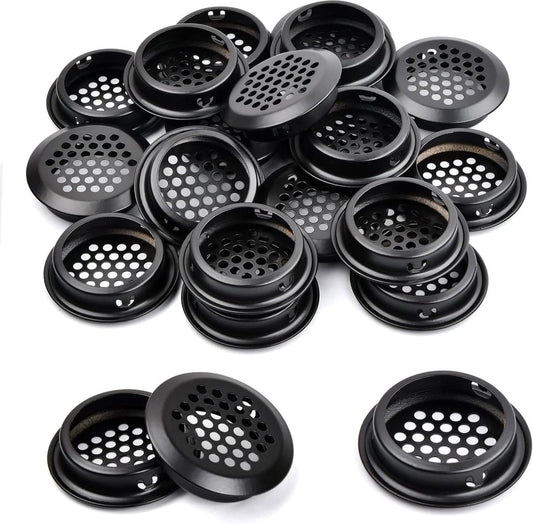 Black round ventilation grille set, perforated discs with black mounting rim.