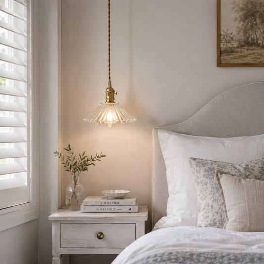 Fleur vintage glass pendant light with clear fluted shade and warm brass hardware on braided cord