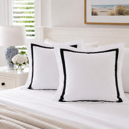 White European pillowcase set with black piping and accent trim, two matching pillowcases.